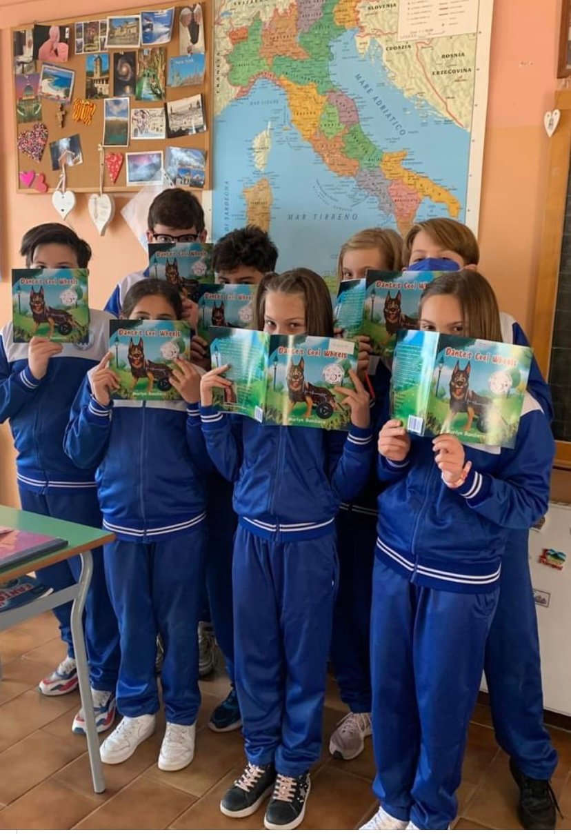 Students holding copies of Dante's Cool Wheels